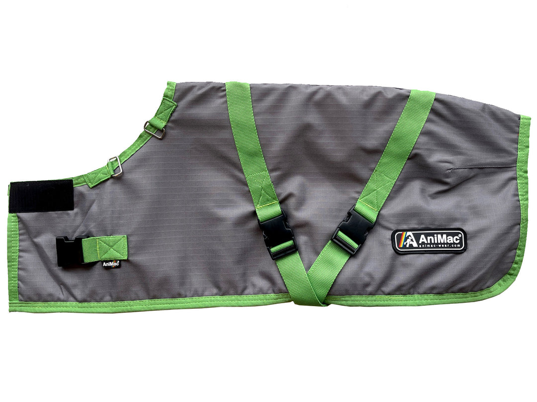 The Super Calf Jacket | Lightweight Waterproof is a gray and green jacket with adjustable straps, buckles, and the AniMac logo, designed to keep newborn calves warm and dry. It can also be used for dogs or small livestock.