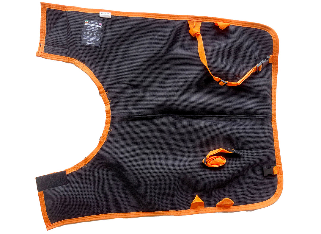 The Super Calf Jacket | Lightweight Waterproof, in black and orange, is laid flat on a white background. It has adjustable straps, buckles, reinforced edges, label, and arm and leg openings to keep newborn calves warm and dry.