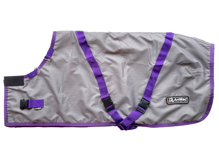 The Super Calf Jacket | Lightweight Waterproof is a gray jacket with purple trim, black buckles, and an AniMac patch, shown flat on a white background—ideal for keeping newborn calves warm.