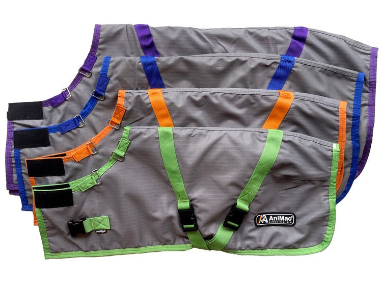 Four Super Calf Jacket | Lightweight Waterproof options in grey with green, orange, purple, or blue trim are displayed overlapping. Each jacket has black straps, velcro fasteners, and the AniMac logo on the front, perfect for keeping newborn calves warm.