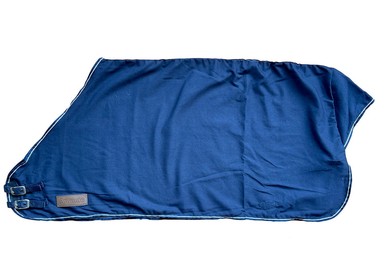 The Travel & Show Sheep Coat, made of blue polycotton with two buckle straps and a stitched corner label, is shown laid flat on a white background.