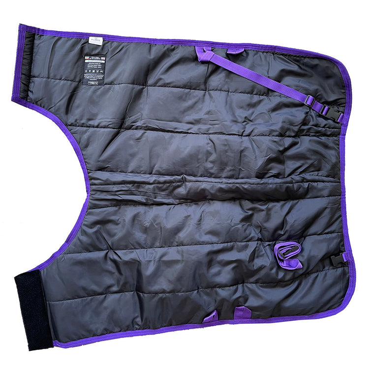 A Super Calf Jacket | Waterproof, in black and purple with quilted design and adjustable straps, lies flat on a white background showing its label and fasteners.